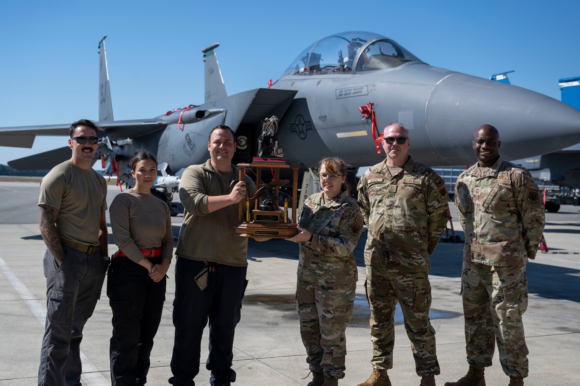 Airmen assigned to the 333rd Fighter Generation Squadron pose for a photo after a quarterly load crew competition at Seymour Johnson Air Force Base, North Carolina, Oct. 13, 2023. The 333rd Fighter Generation Squadron were the winners of the load crew competition.(U.S. Air Force photo by Senior Airman David Lynn)