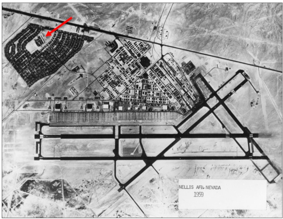 High altitude image of Nellis Air Force Base from 1959, the red arrow is pointing to the school.
