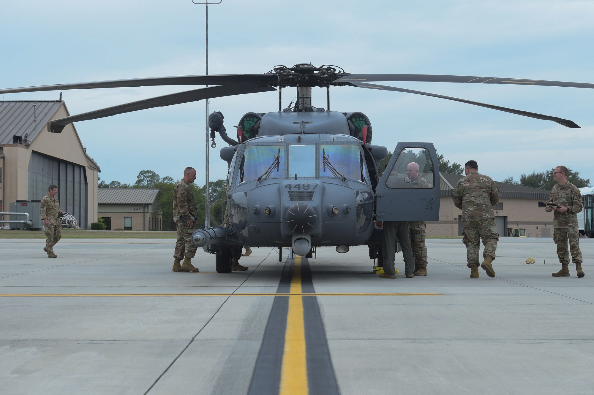 U.S. Air Force leadership assigned to the 23rd Wing, look around an HH-60W Jolly Green II during a Top Tiger Competition at Moody Air Force Base, Georgia, Oct. 6, 2023. The quarterly competition is designed to inspire a competitive spirit between fellow Airmen while demonstrating their skill sets. (U.S. Air Force photo by Airman Cade Ellis)