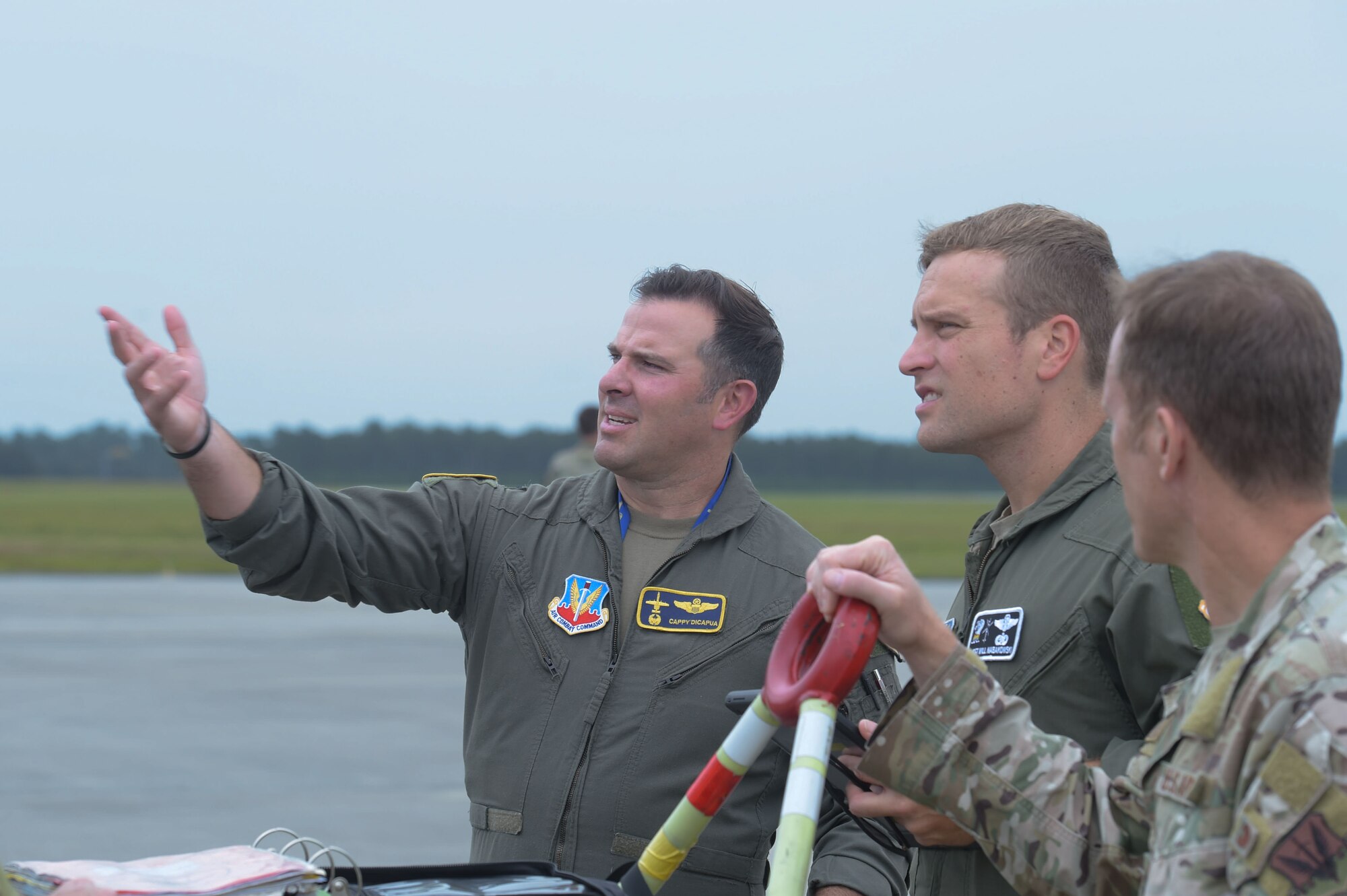 U.S. Air Force Col. Nicholas DiCapua, 23rd Fighter Group commander, left, talks with other leadership members about the HC-130J Combat King II at Moody Air Force Base, Georgia, Oct. 6, 2023. Leadership had 15 minutes to inspect each aircraft and give a rating for the Top Tiger competition. (U.S. Air Force photo by Airman Cade Ellis)