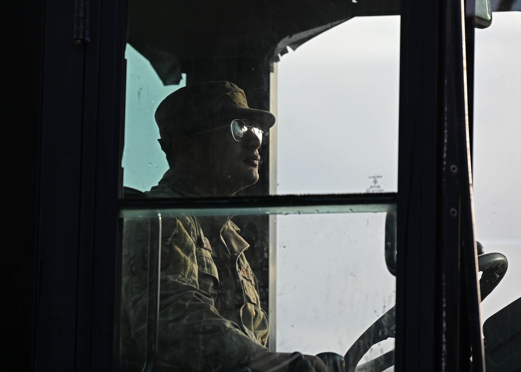 U.S. Air Force Senior Airman Edmundo Garcia, electrical power production journeyman with the 627th Civil Engineer Squadron, operates a front loader during a vehicle rodeo at Joint Base Lewis-McChord, Washington, Oct. 12, 2023. The 627th CES held a vehicle rodeo to license Airmen, so they can operate compact track loaders, backhoes, front end loaders, dump trucks, all terrain forklifts and street sweepers, ensuring multi-capable Airmen capabilities and mission readiness. (U.S. Air Force photo by Senior Airman Callie Norton)