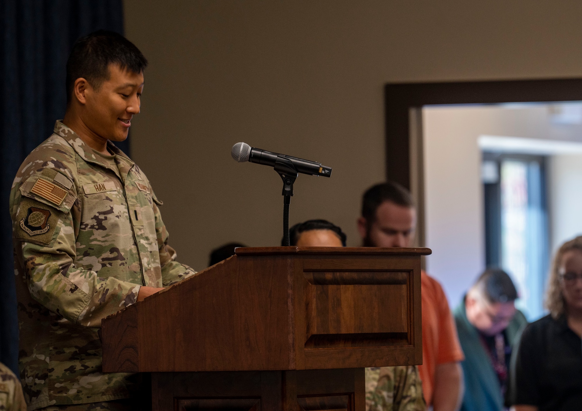 1st Lieutenant Samuel Han recites an invocation during an opening ceremony.