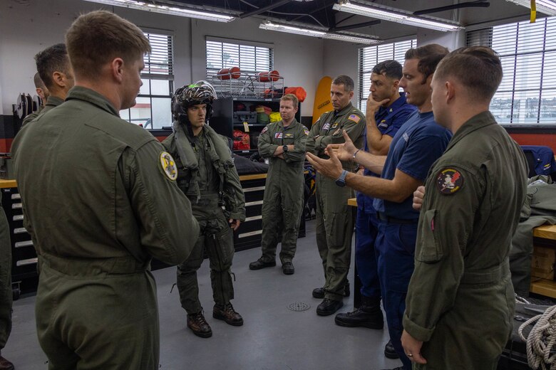 U.S. Marine Corps Capt. Peter Lindsey, a pilot with Marine Fighter Attack Training Squadron (VMFAT) 502, Marine Aircraft Group 11, 3rd Marine Aircraft Wing, demonstrates the aviation life support equipment worn by F-35B Lightning II pilots