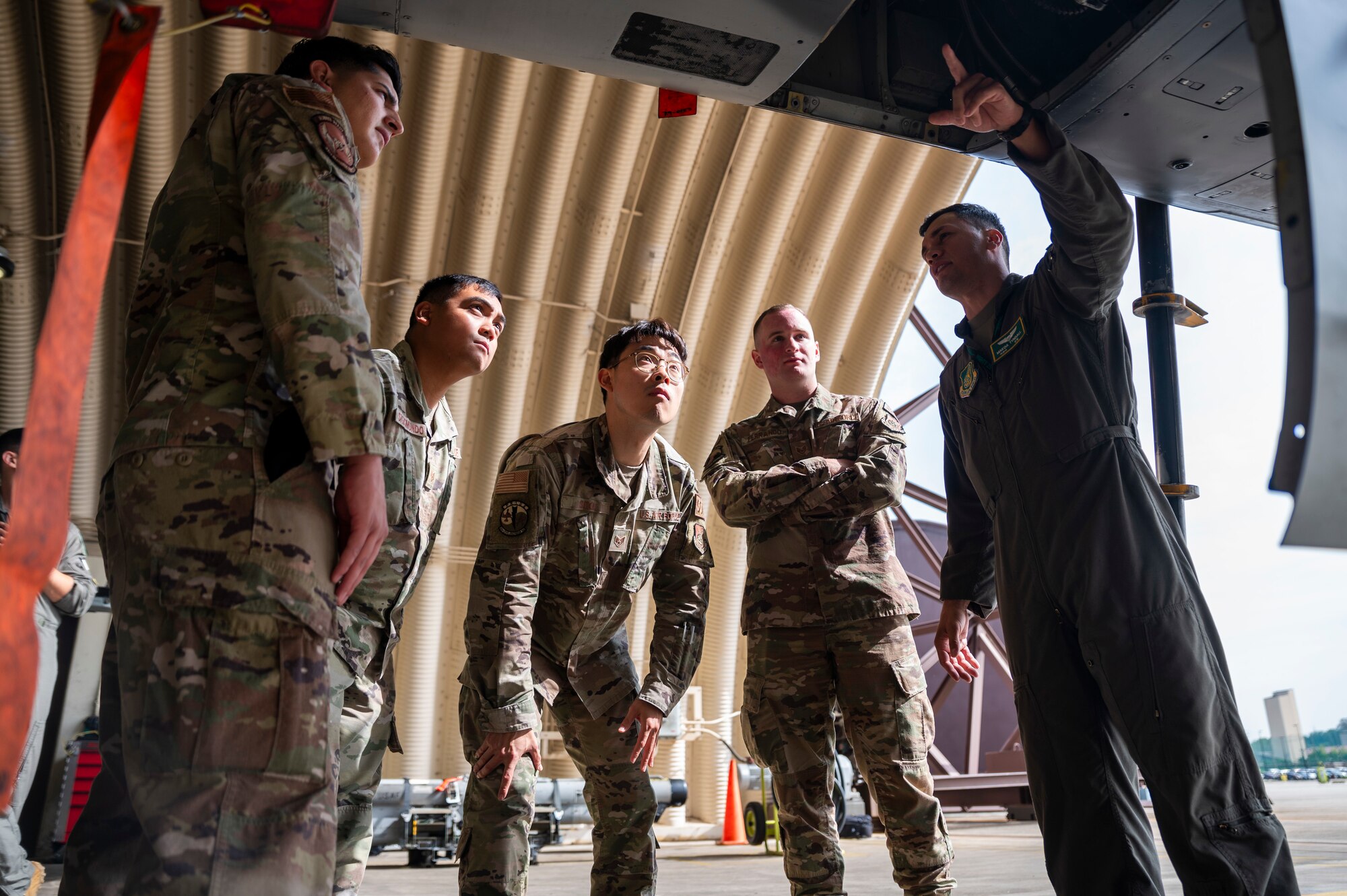 U.S. Air Force Capt. Makoa Tyndall, 25th Fighter Squadron director of staff, gives a tour in an A-10C Thunderbolt II hangar as part of the Buddy Squadron program at Osan Air Base, Republic of Korea, Oct. 6, 2023.