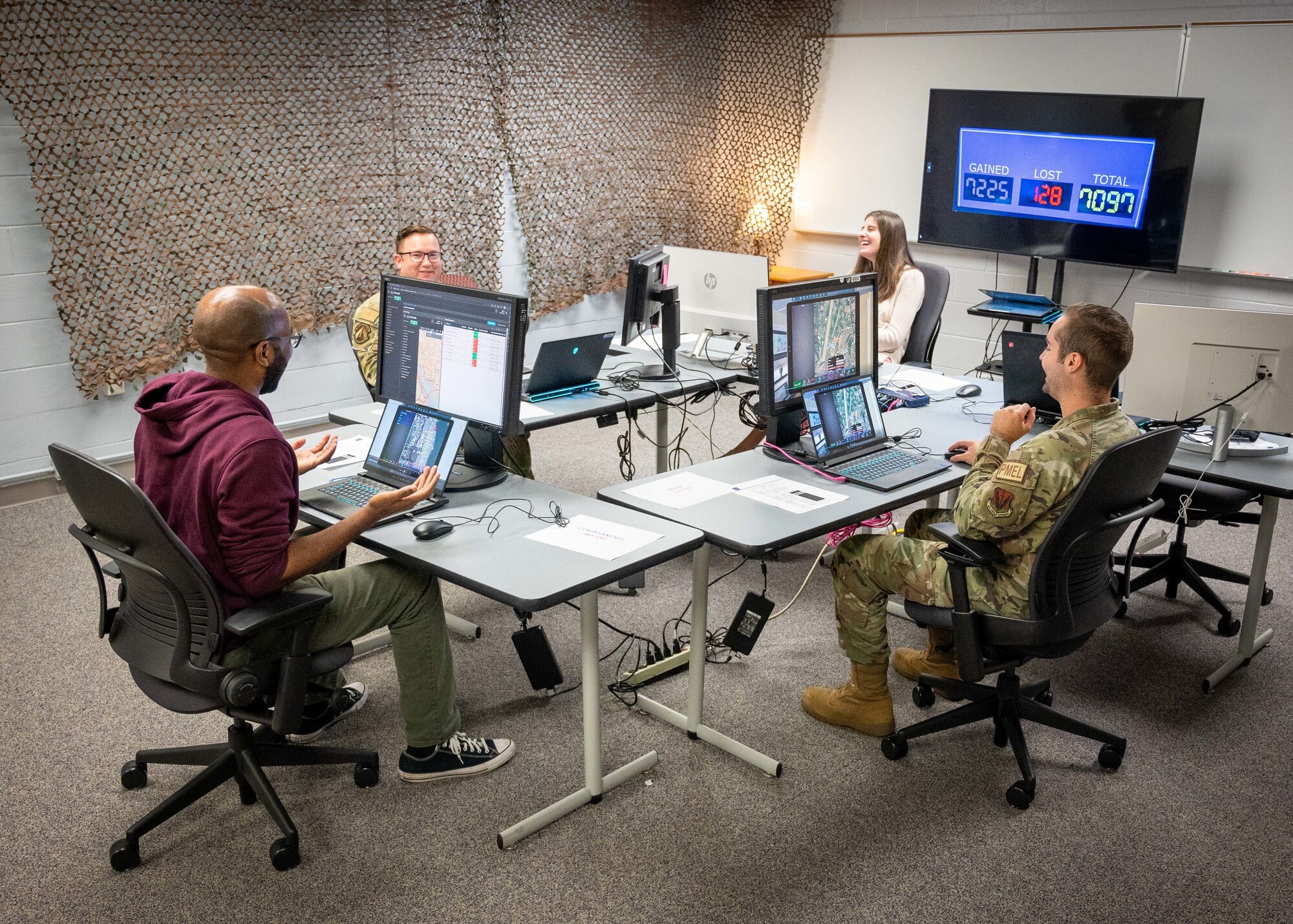 A group of players engage in a team based video game.