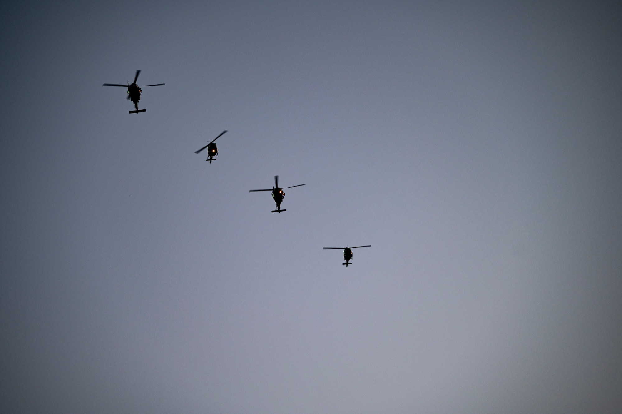Helicopters fly in the sky