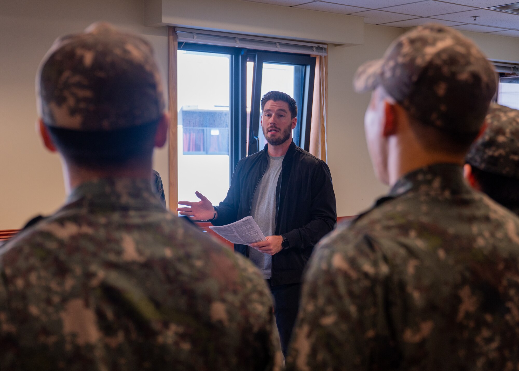 U.S. Air Force Tech. Sgt. James Butts briefs members of the Republic of Korea Air Force 38th Fighter Group military police on taser safety and practices in preparation for the first-ever combined security patrol.