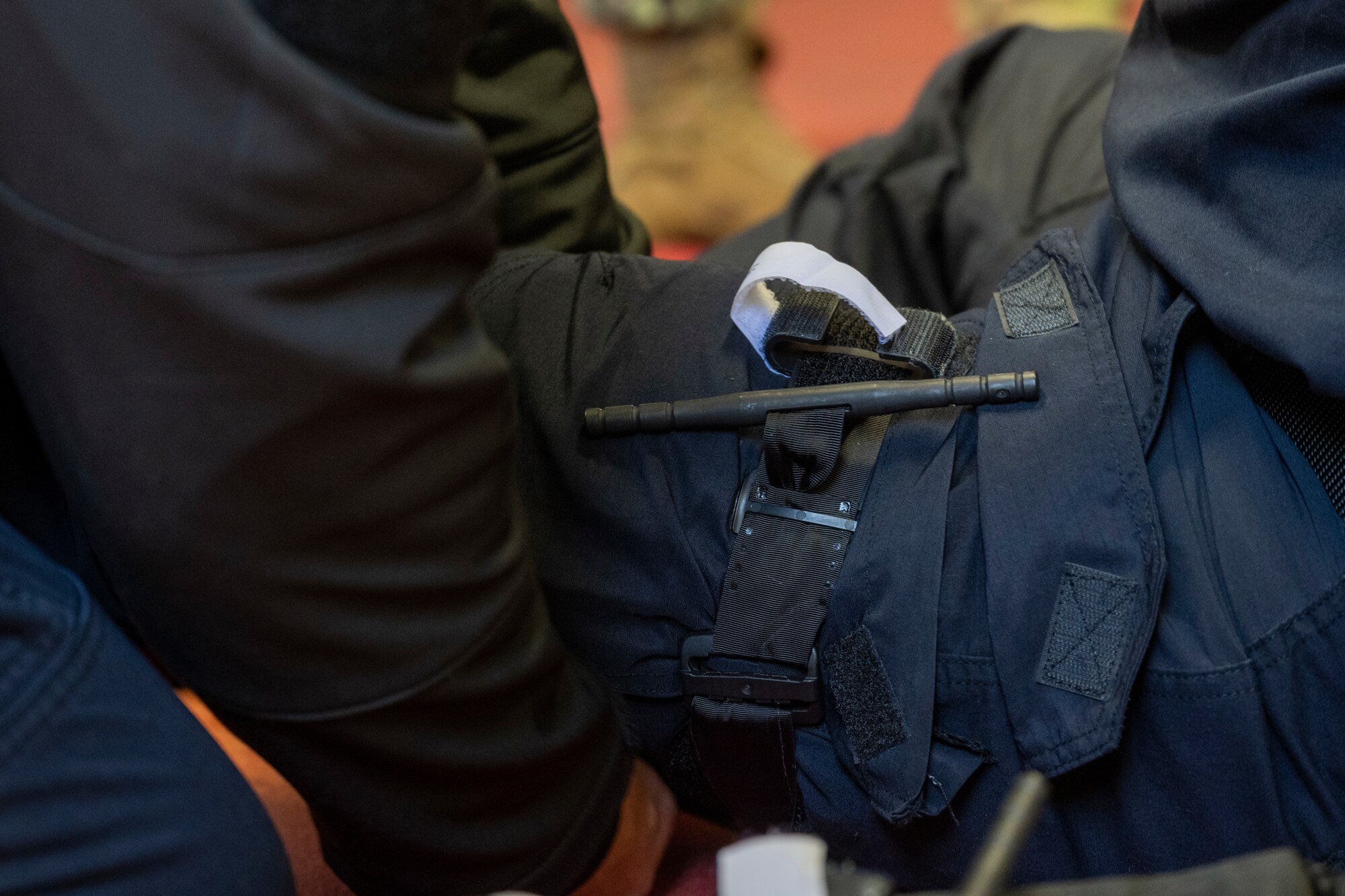 Police member applies tourniquets.