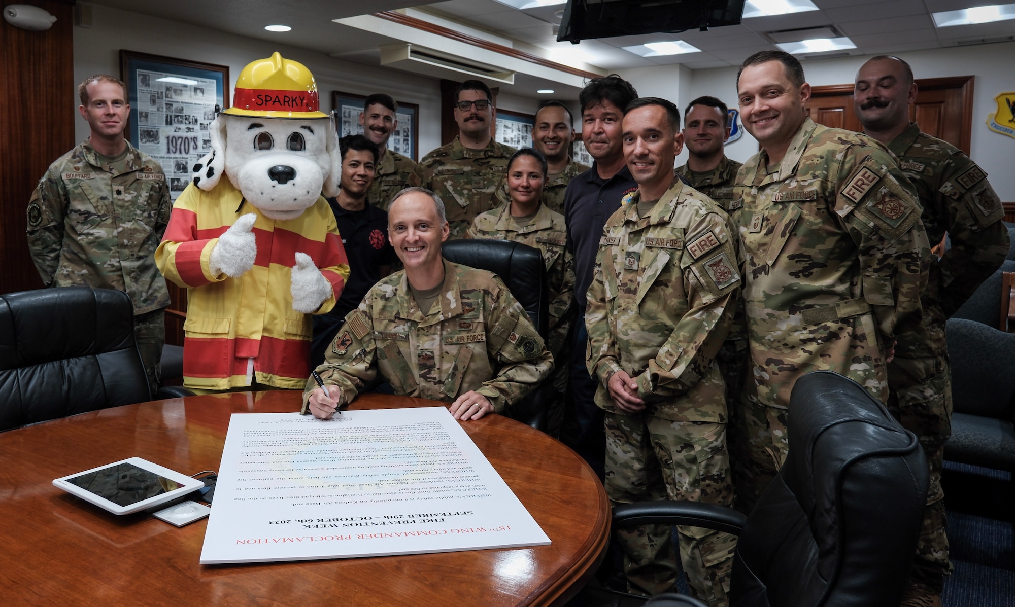 Col. Lundeby poses with 18th Wing Civil Engineer members
