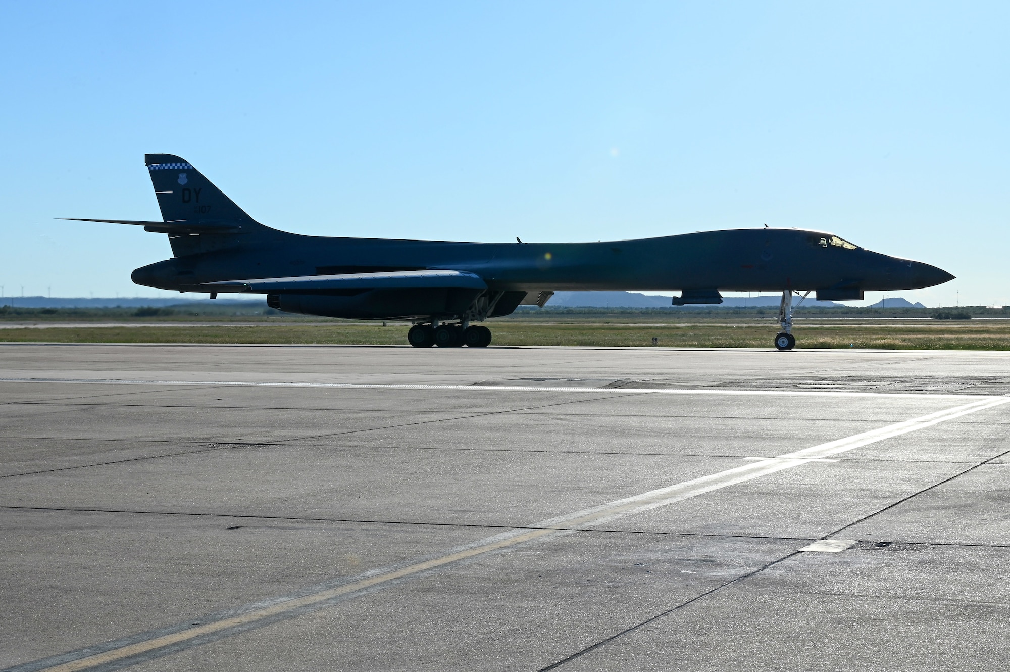 A B-1B Lancer taxis on the flightline at Dyess Air Force Base, Texas, Oct. 11, 2023, to kick off a U.S. European Command Bomber Task Force deployment. Presence is our most visible symbol of assurance and commitment to our allies and provides deterrence against potential adversaries. (U.S. Air Force photo by Senior Airman Sophia Robello)