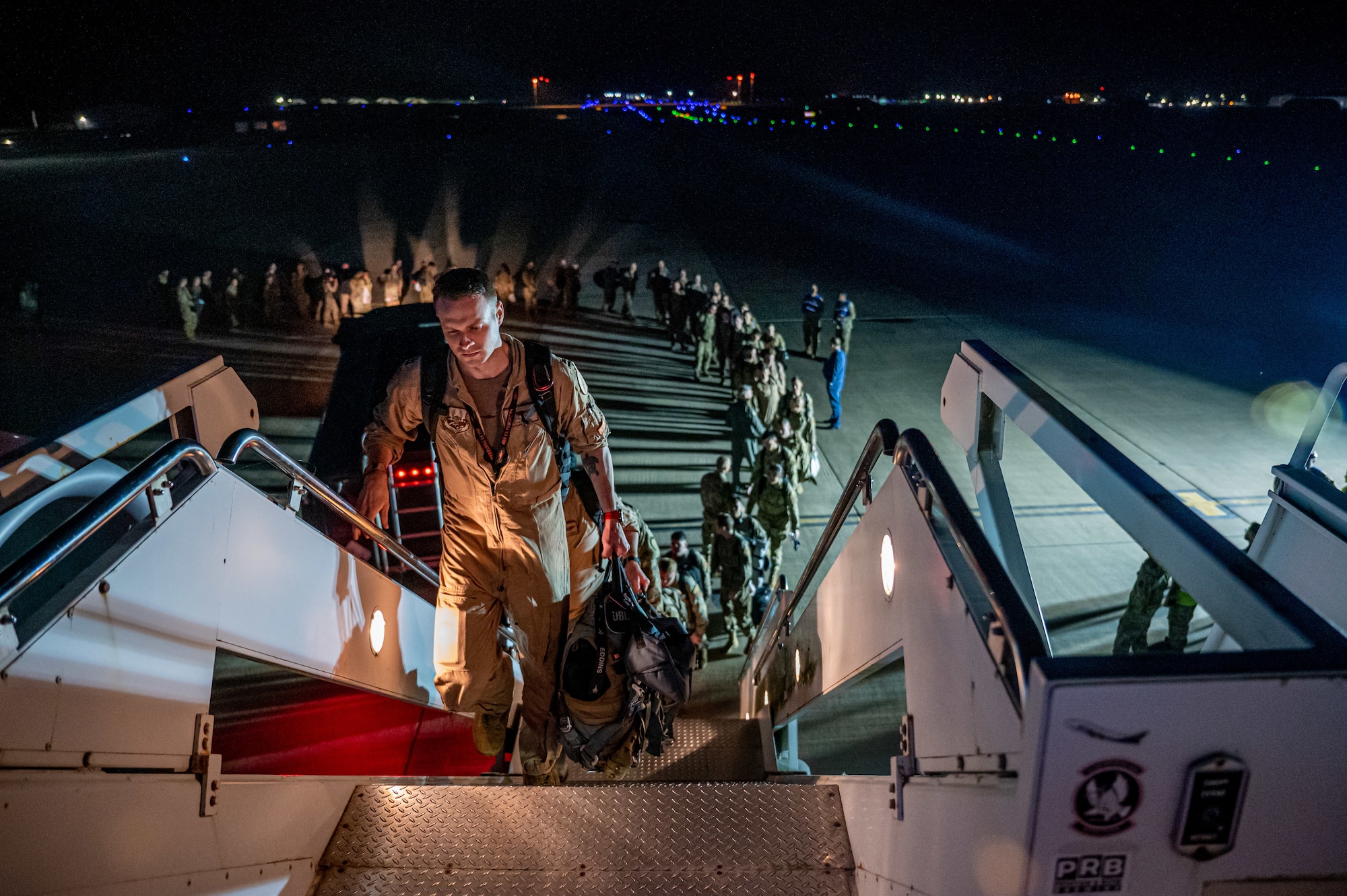 U.S. Airmen board an aircraft