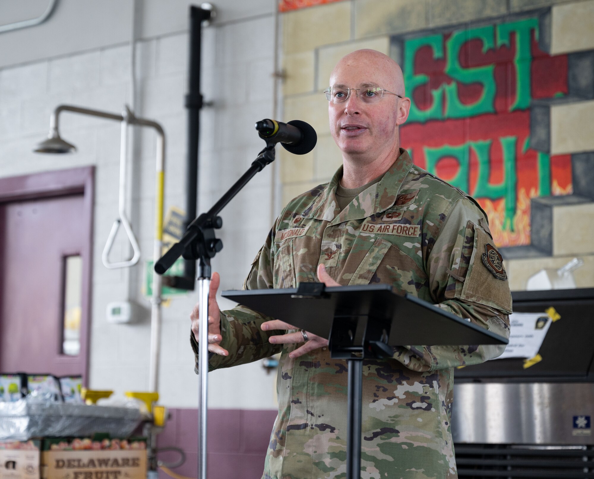 Col. Chris McDonald, 436th Airlift Wing commander, speaks during the 10th Annual Military Appreciation Day and 2023 Fire Prevention Week Open House at Dover Air Force Base, Delaware, Oct. 14, 2023. The event celebrated Team Dover Airmen’s service to our nation and included food, games, face painting and bouncy houses. (U.S. Air Force photo by Senior Airman Cydney Lee)