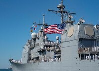NORFOLK, Va. -  The Ticonderoga-class guided-missile cruiser USS Philippine Sea (CG 58) departs Naval Station Norfolk for a scheduled deployment, Oct. 13, 2023. Philippine Sea is deploying as part of the Dwight D. Eisenhower Carrier Strike Group. (U.S. Navy photo by Mass Communication Specialist 1st Class Ryan Seelbach)