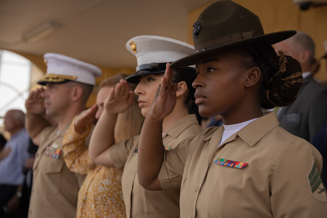 U.S. Marines salute during the playing of the Star Spangled Banner as a part of a graduation ceremony at Marine Corps Recruit Depot San Diego, Oct. 13, 2023. Graduation took place at the completion of the 13- week transformation, which included training for drill, marksmanship, basic combat skills, and Marine Corps customs and traditions. (U.S. Marine Corps photo by Lance Cpl. Janell B. Alvarez)