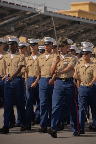 U.S. Marine Corps Staff Sgt. Jesus Aguilera, a drill instructor with Echo Company, 2nd Recruit Training Battalion, marches in formation during a graduation ceremony at Marine Corps Recruit Depot San Diego, Oct. 13, 2023. Graduation took place at the completion of the 13- week transformation, which included training for drill, marksmanship, basic combat skills, and Marine Corps customs and traditions. Aguilera is native of Sacramento, Calif. (U.S. Marine Corps photo by Lance Cpl. Janell B. Alvarez)