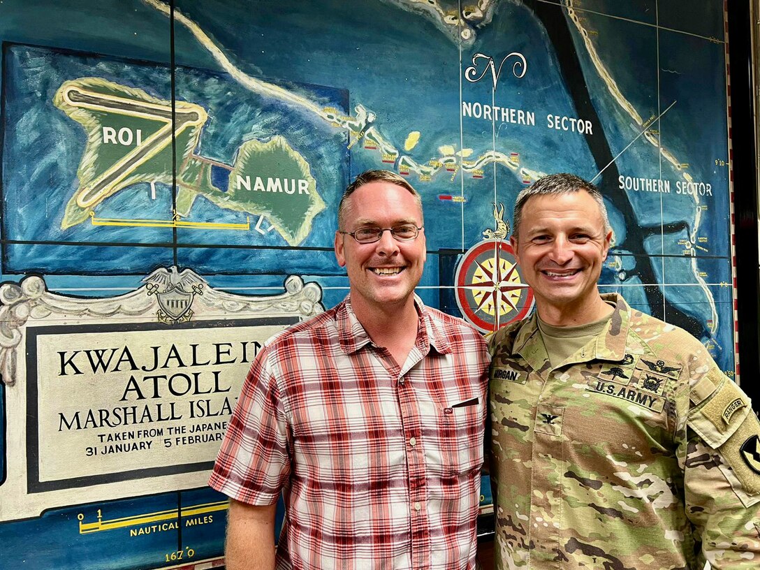 Capt. Nicholas Simmons, commander of U.S. Coast Guard Forces Micronesia/Sector Guam (CGFM/SG), stands for a photo with Col. Drew Morgan, commander of U.S. Army Garrison Kwajalein, on Sept. 25, 2023. Simmons led a delegation to the Republic of the Marshall Islands (RMI), one of the three former trust territories under the Compact of Free Association (COFA). The visit underscores CGFM/SG's strengthened role as the primary facilitator of the cooperative relationship between the U.S. Coast Guard and the RMI, reinforcing longstanding ties. (U.S. Coast Guard photo)