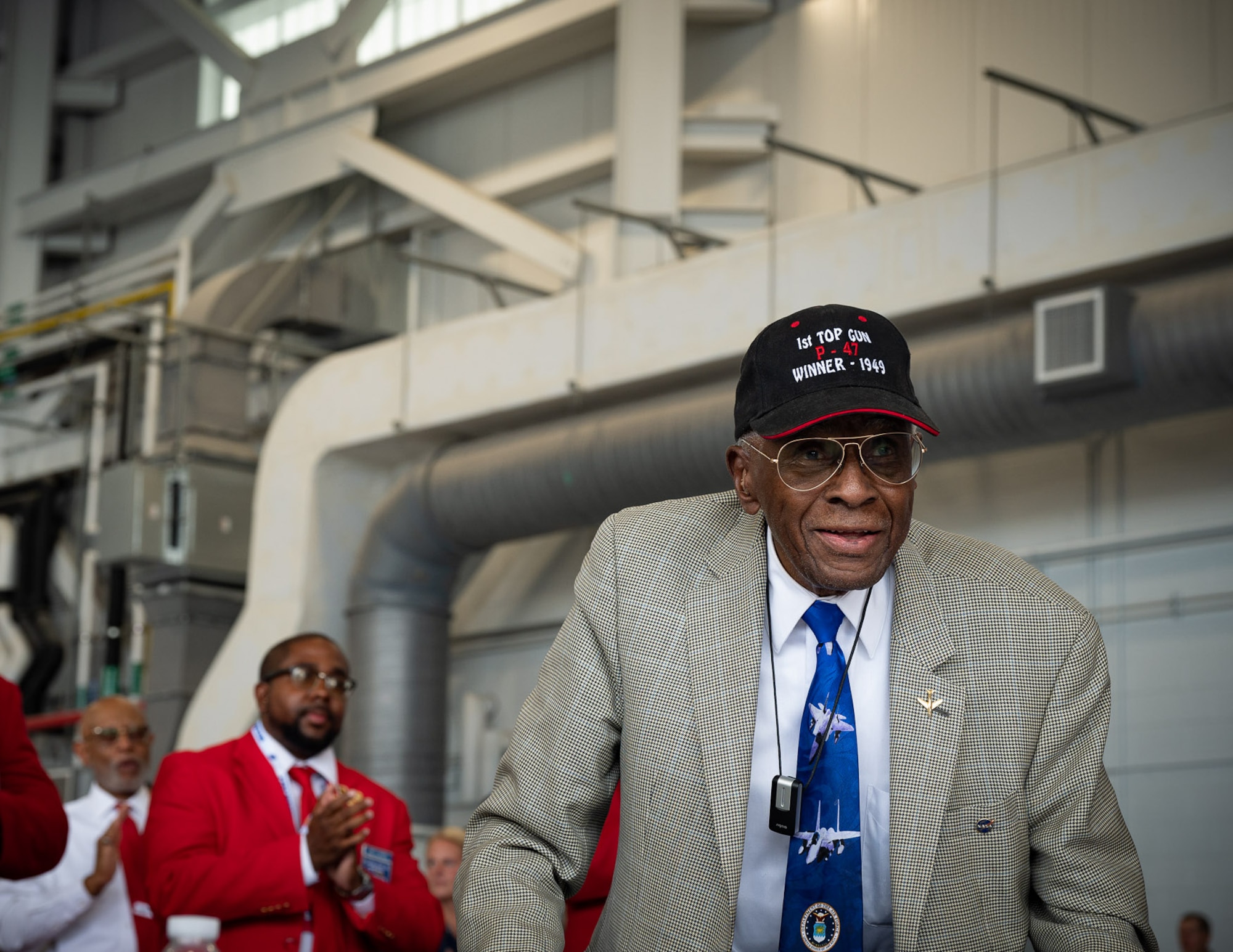U.S. Air Force retired Lt. Col. James Harvey III a member of the storied 332nd Fighter Group of the Tuskegee Airmen is applauded during the William Tell 2023 opening ceremony dinner at the Air Dominance Center in Savannah, Ga. Col. Harvey and the 332d Fighter Group were the winners of the “Best Overall Team Award” during the first-ever gunnery meet held in 1949 at Nellis Air Force Base, Nevada. The best air and ground crews from across the Air Force fighter enterprise will compete in September at the 2023 William Tell Air-to-Air Weapons Meet, the first fighter competition of its kind in nearly two decades.