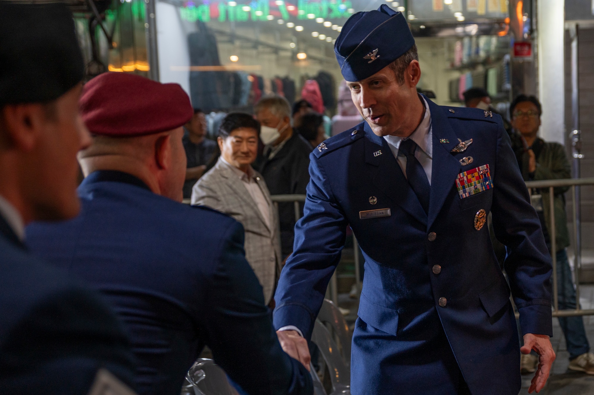 U.S. Air Force Col. William McKibban, 51st Fighter Wing commander, shakes hands with Col. Patrick Lowe, 607th Air Support Operations Group commander, during the 20th ROK U.S. Friendship Festival, near Osan Air Base, Republic of Korea, Oct. 14, 2023.