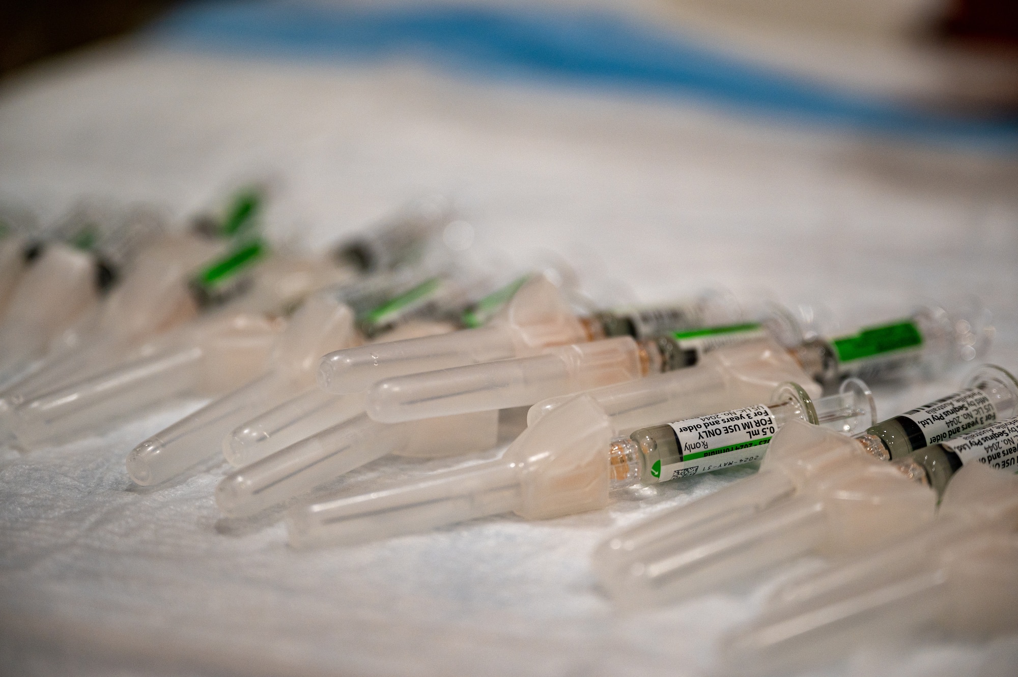 Influenza vaccines are lined up on a table during a public health emergency exercise at Osan Air Base, Republic of Korea, Oct. 12, 2023. During the exercise, medics from the 51st Medical Group utilized the vaccinations to practice mass prophylaxis techniques. The vaccines acted as a stand-in for medication in a simulated scenario, offering a practical training opportunity while increasing real life readiness by administering annual influenza vaccinations to active duty service members. (U.S. Air Force photo by Staff Sgt. Thomas Sjoberg)