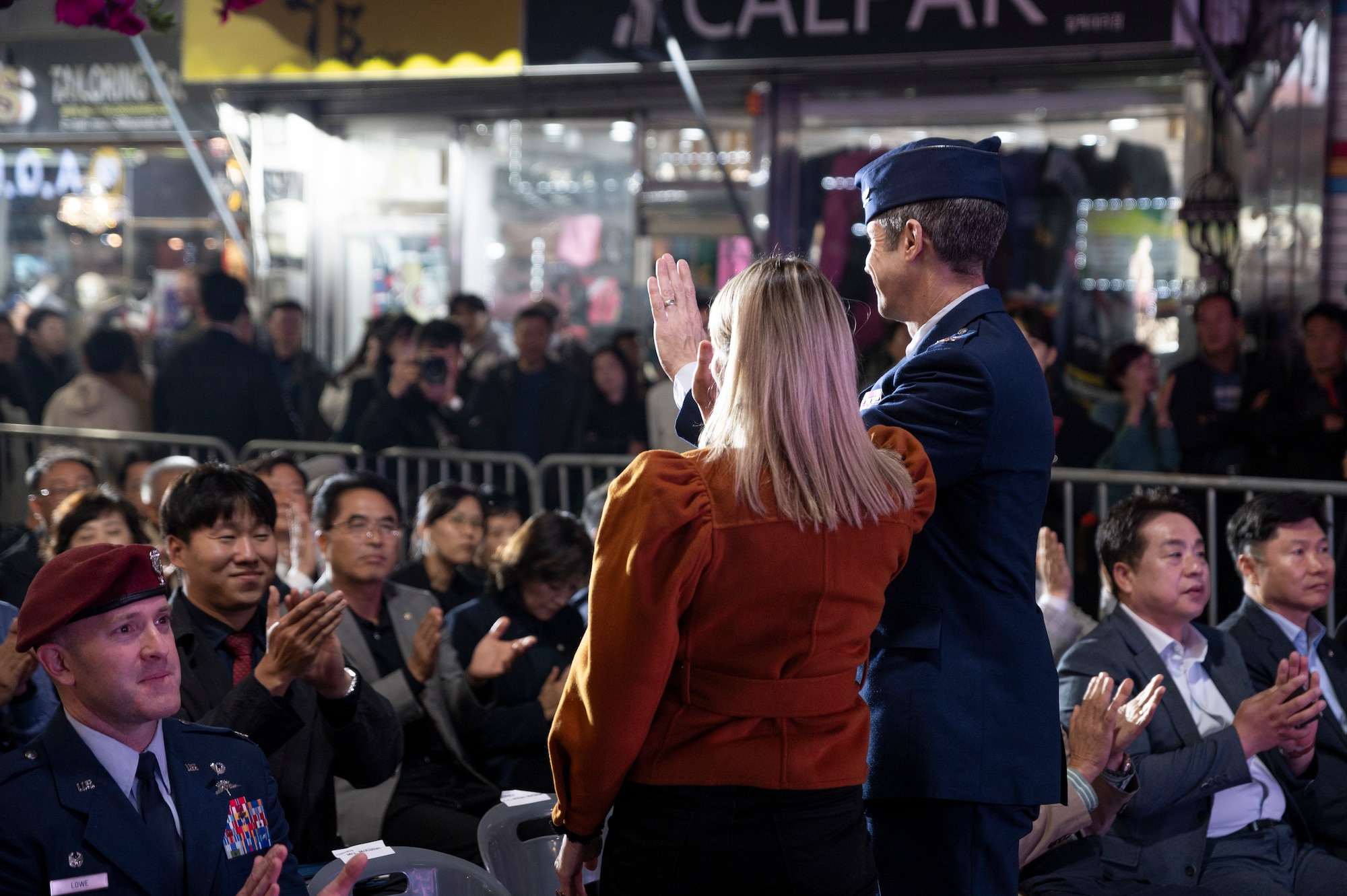 U.S. Air Force Col. William McKibban, 51st Fighter Wing commander, and Amber McKibban, spouse of McKibban, wave to a crowd during the 20th ROK U.S. Friendship Festival, near Osan Air Base, Republic of Korea, Oct. 14, 2023.