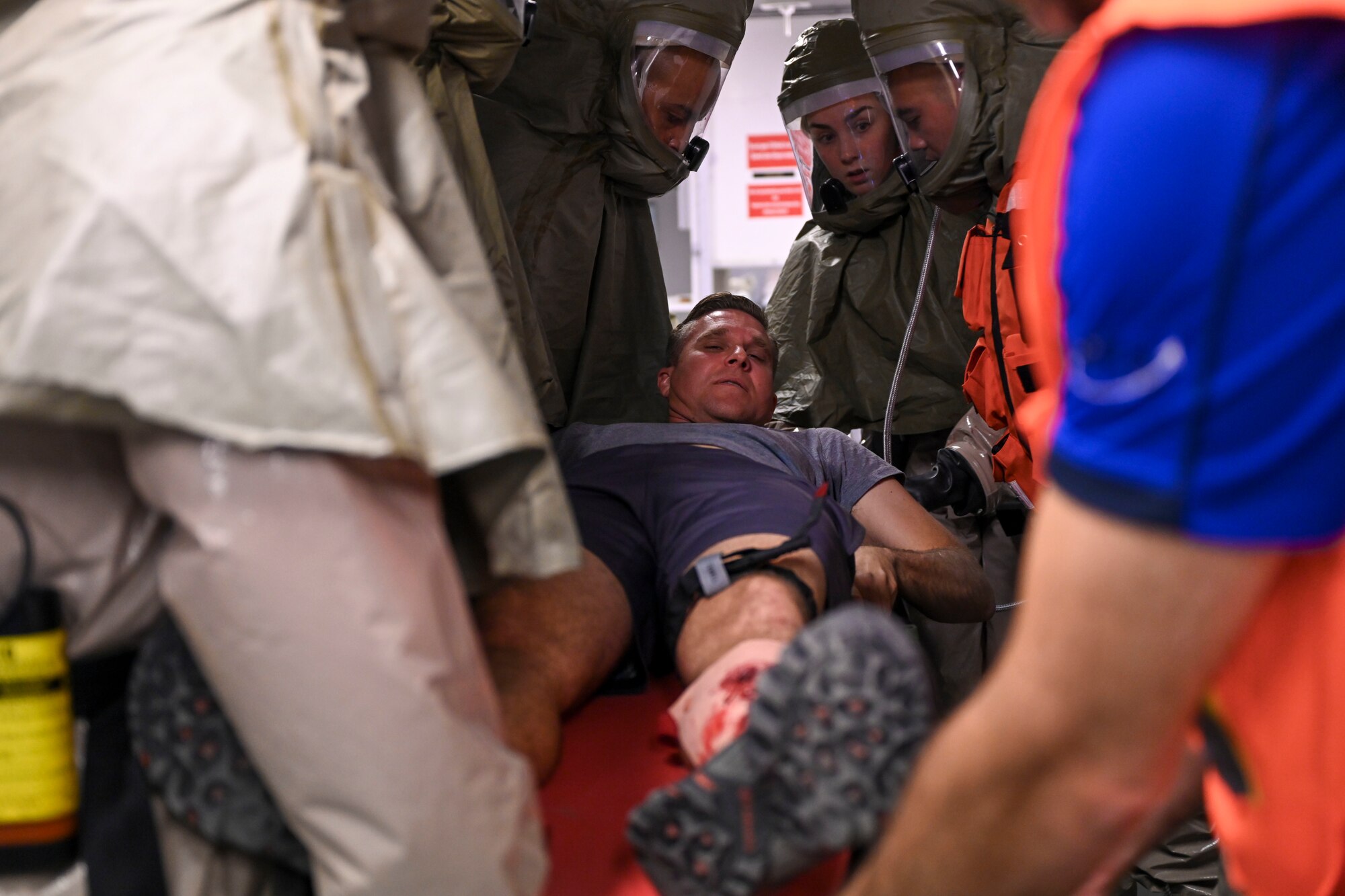 U.S. Air Force Col. Robert N. Schoeneberg, 39th Air Base Wing vice commander, goes through decontamination while posing as a simulated mass casualty victim during exercise “Ready Eagle” at Incirlik Air Base, Türkiye, Oct. 12, 2023.