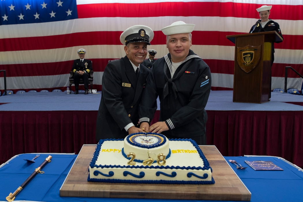 U.S. Naval Forces Europe-Africa Fleet Master Chief Johannes J. Gonzalez and Builder Constructionman Apprentice Tristan Plomb, assigned to Naval Support Activity Souda Bay, cut a ceremonial cake during a U.S. Navy 248th Birthday Celebration held onboard NSA Souda Bay on Oct. 13, 2023.