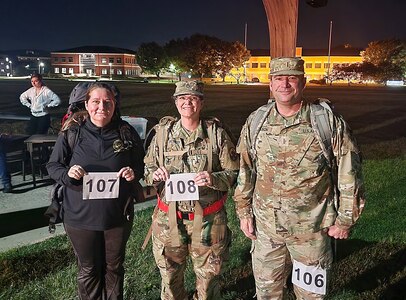 Chief Warrant Officer 5 Lee Nelson is pictured with his wife, left, retired Chief Warrant Officer 4 Deborah Nelson, and sister, Sgt. 1st Class Kelly Jacobson, prior to the start of the Norwegian Foot March, Oct 1., at Fort Detrick, Maryland. (Photo Credit: Courtesy)