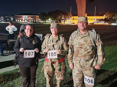 Chief Warrant Officer 5 Lee Nelson is pictured with his wife, left, retired Chief Warrant Officer 4 Deborah Nelson, and sister, Sgt. 1st Class Kelly Jacobson, prior to the start of the Norwegian Foot March, Oct 1., at Fort Detrick, Maryland. (Photo Credit: Courtesy)