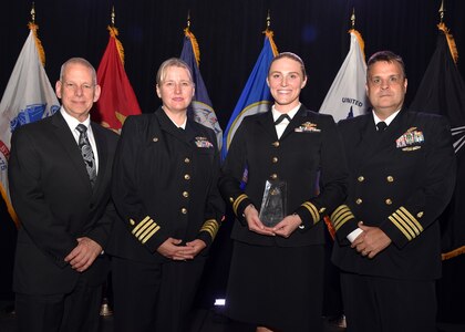SAN ANTONIO – (Oct. 12, 2023) – Lt. Rachel Robeck, of Atlanta, a Navy Emergency Medicine physician assistant assigned to Naval Medical Research Unit (NAMRU) San Antonio, was recognized as a Hero of Military Medicine honoree during the 2023 Heroes of Military Medicine San Antonio Awards Program held at The Red Berry Estate. Pictured with Robeck from NAMRU San Antonio are from left to right:  Chief Science Director Dr. Sylvain Cardin, Commanding Officer Jennifer Buechel, and Executive Officer Ewell Hollis. The awards program, hosted by the Henry M. Jackson Foundation for the Advancement of Military Medicine, Inc., recognized exception community leaders who advance military medicine in and around the greater San Antonio area. The event brought the story of Military City USA’s unique military and civilian medical research and clinical care collaborations to national and global attention. NAMRU San Antonio’s mission is to conduct gap driven combat casualty care, craniofacial, and directed energy research to improve survival, operational readiness, and safety of Department of Defense (DoD) personnel engaged in routine and expeditionary operations. It is one of the leading research and development laboratories for the U.S. Navy under the DoD and is one of eight subordinate research commands in the global network of laboratories operating under the Naval Medical Research Command in Silver Spring, Md. (U.S. Navy photo by Burrell Parmer, NAMRU San Antonio Public Affairs/Released)