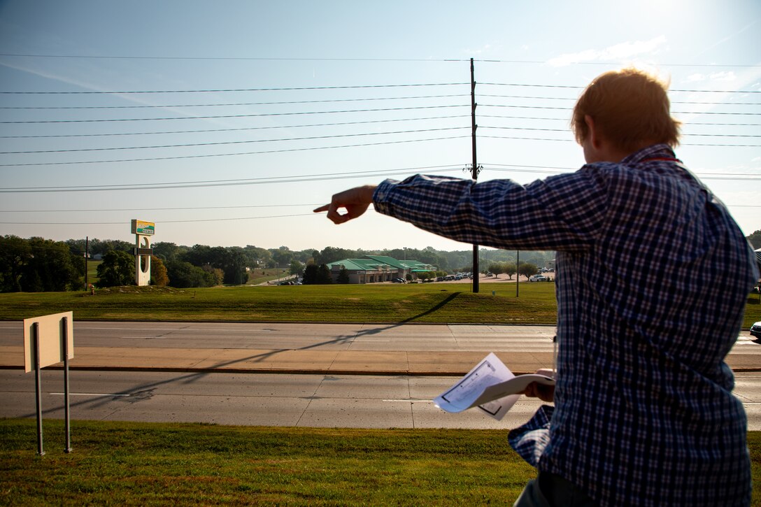 Connor Gann, a reality specialist from the USACE Omaha District Real Estate Military Branch, overlooks a stretch of road easement during a compliance inspection, near Sioux City, Iowa, September 18, 2023.