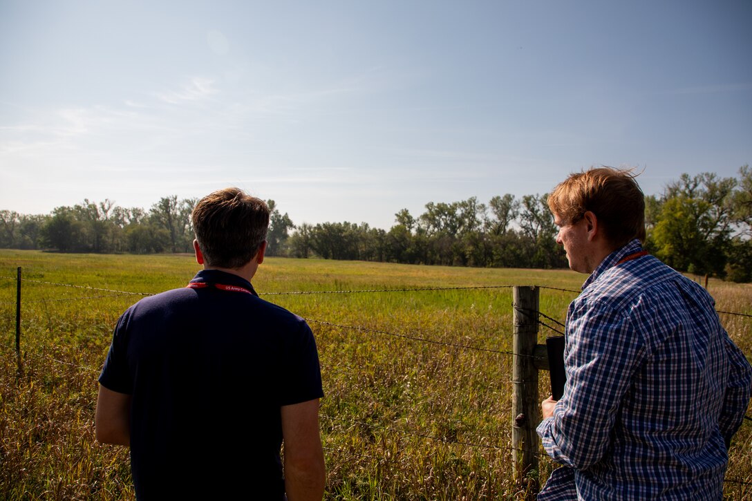 Realty Specialists Jake Moran (left) and Connor Gann, both from the USACE Omaha District Real Estate Military Installations Branch, conduct a compliance inspection of an agriculture lease crop field, September 18, 2023. (U.S. Army photo by Sarah Rich)