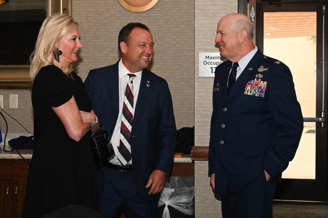 Col. J.C. Miller, 433rd Operations Group commander, converses with 433rd Airlift Wing Honorary Commanders Program alum Dave Bonney, First Command financial advisor, principal and district advisor, and his guest at the 433rd Airlift Wing 2023 Honorary Commanders’ Induction ceremony in San Antonio, May 6, 2023.