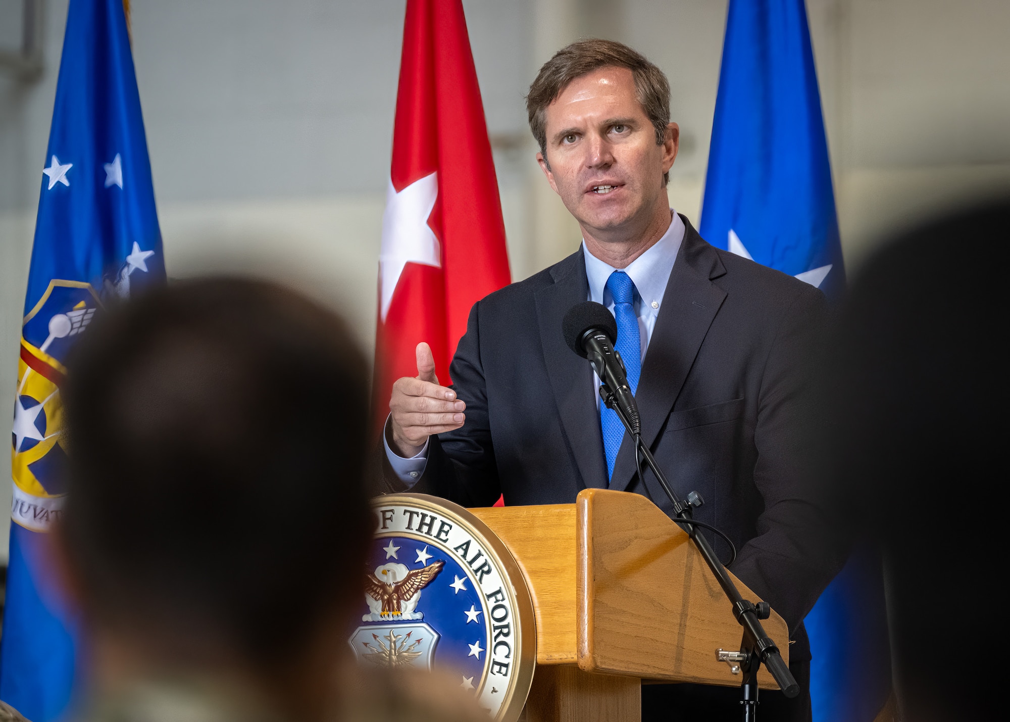 Kentucky Gov. Andy Beshear speaks to members of the 123rd Airlift Wing during an award ceremony at the Kentucky Air National Guard Base in Louisville, Ky., Oct. 14, 2023. The unit received its 20th Air Force Outstanding Unit Award and a Meritorious Unit Award for superior achievement in a broad spectrum of missions around the world since 2019. (U.S. Air National Guard photo by Dale Greer)