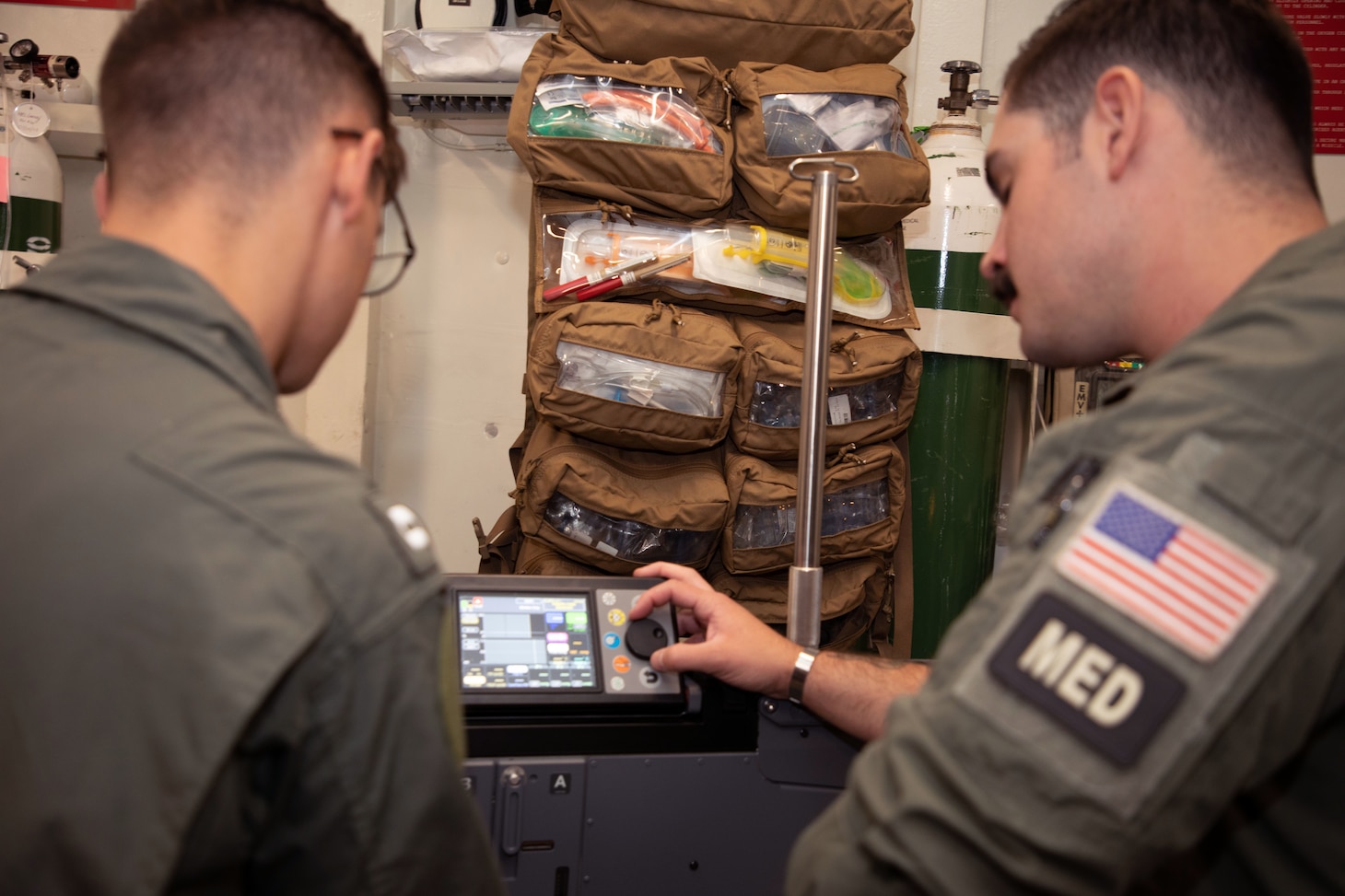From left, Lt. Kyle Rowland, a critical care nurse assigned to Navy Medicine Readiness and Training Command (NMRTC) Camp Lejeune, and Hospital Corpsman 2nd Class Bradley Christian, a search and rescue medical technician assigned to NMRTC Patuxent River, test an integrated intensive care mobile unit during inventory in the medical department aboard Nimitz-class aircraft carrier USS Dwight D. Eisenhower (CVN 69).