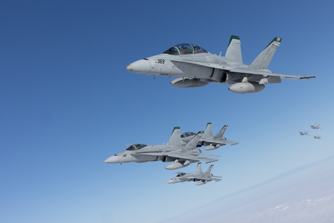 U.S. Marines with Marine Fighter Attack Training Squadron (VMFAT) 101, Marine Aircraft Group 11, 3rd Marine Aircraft Wing, conduct a mass formation launch known as “flying the barn,” to honor the squadron’s legacy on the day of its deactivation at Marine Corps Air Station Miramar, California, Sept. 29, 2023. For more than 50 years, instructor pilots of the VMFAT-101 “SharpShooters” have qualified combat aviators and sent them to operational squadrons worldwide. (U.S. Marine Corps photo by Lance Cpl. Samantha Devine)