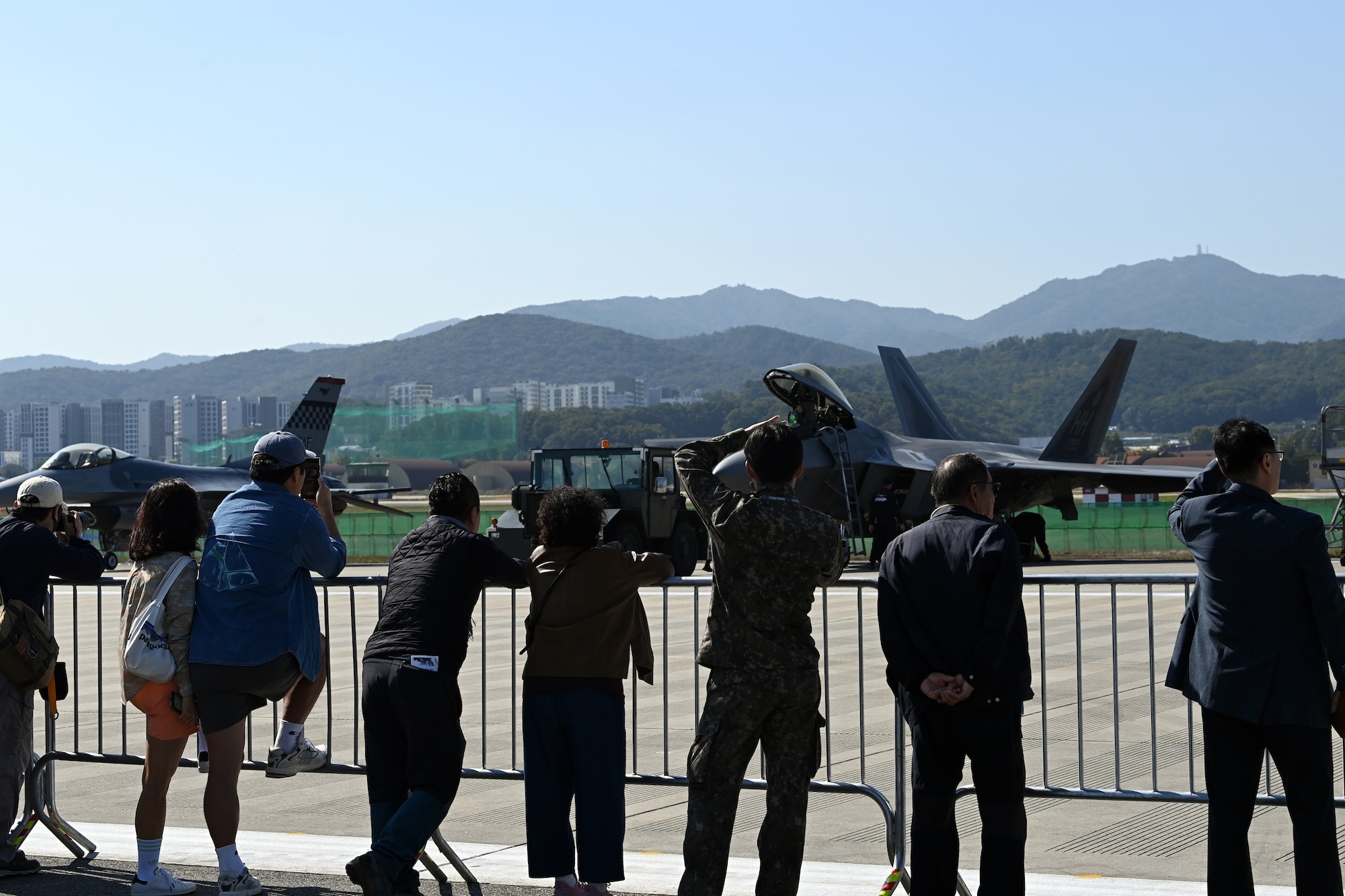 Visitors at the 2023 Seoul International Aerospace and Defense Exhibition take photos of U.S. Air Force aircraft during media day at Seoul Air Base, Republic of Korea, Oct. 16, 2023.