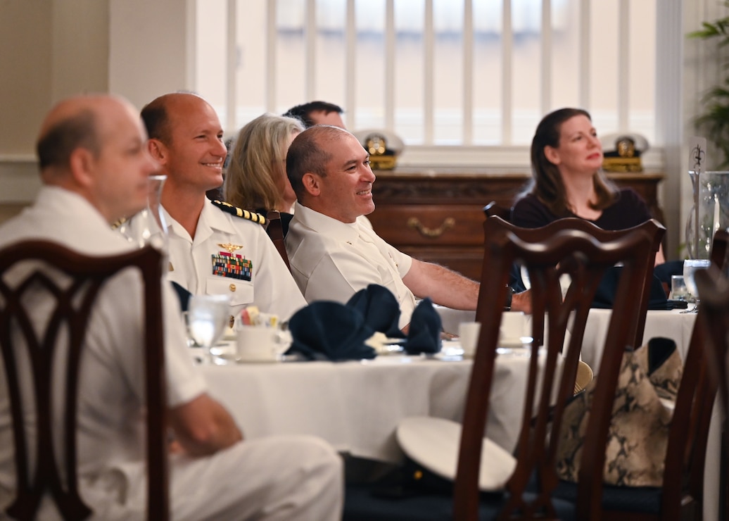 230927-N-VP266-0112 WASHINGTON (Sep. 27, 2023) Guests in attendance at Naval District Washington’s Ombudsmen Appreciation luncheon, listen to guest speakers deliver remarks, September 27, 2023. Navy ombudsmen serve as a liaison between commands and family members within a command, including spouses, parents, and extended family members. (U.S. Navy photo by Mass Communication Specialist 2nd Class Griffin Kersting)