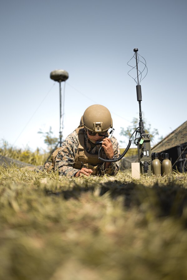 U.S. Marine Corps Lance Cpl. Julio Tinocodominguez, a digital wideband transmission equipment operator, assigned to 5th Air Naval Gunfire Liaison Company, III Marine Expeditionary Force Information Group, relays targeting information during exercise Katana Strike on Kumejima, Okinawa, Japan, Oct. 26, 2022. Katana Strike is led by III Marine Expeditionary Force Information Group and is designed to demonstrate proficiency in coalition joint-force planning, coordination, and execution of dynamic targeting in a maritime environment that utilizes ground forces to initiate the targeting cycle. Katana Strike showcases 5th Air Naval Gunfire Liaison Company, which serves as the central hub for conducting long-range communications between joint ground, naval and aviation units over multiple waveforms. III MIG functions as the vanguard of III MEF, operating in the Indo-Pacific regions information environment, and supports Marine Air Ground Task Force operations with communications, intelligence, and supporting arms liaison capabilities. (U.S. Marine Corps photo by Staff Sgt. Manuel Serrano)