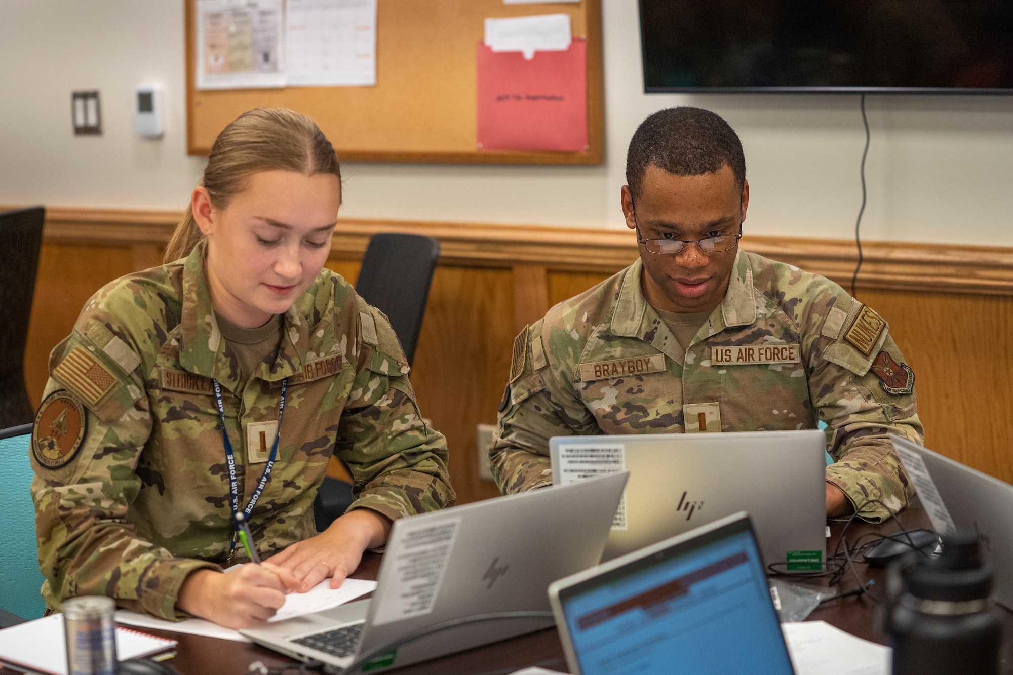 U.S. Air Force 2nd Lts. Morgan Strickland and Ke'Andre Brayboy, 335th Training Squadron operation analysis students, work on calculus problems together at Allee Hall on Keesler Air Force Base, Mississippi, Oct. 10, 2023.