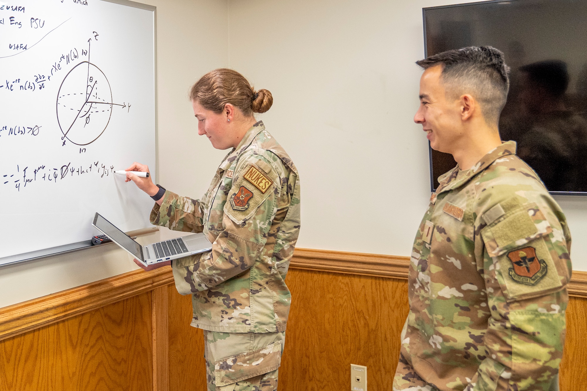U.S. Air Force 2nd Lts. Emelia McLaughlin and Sean Richard, 335th Training Squadron operation analysis students, work on finding the value of functions at Allee Hall at Keesler Air Force Base, Mississippi, Oct. 10, 2023.