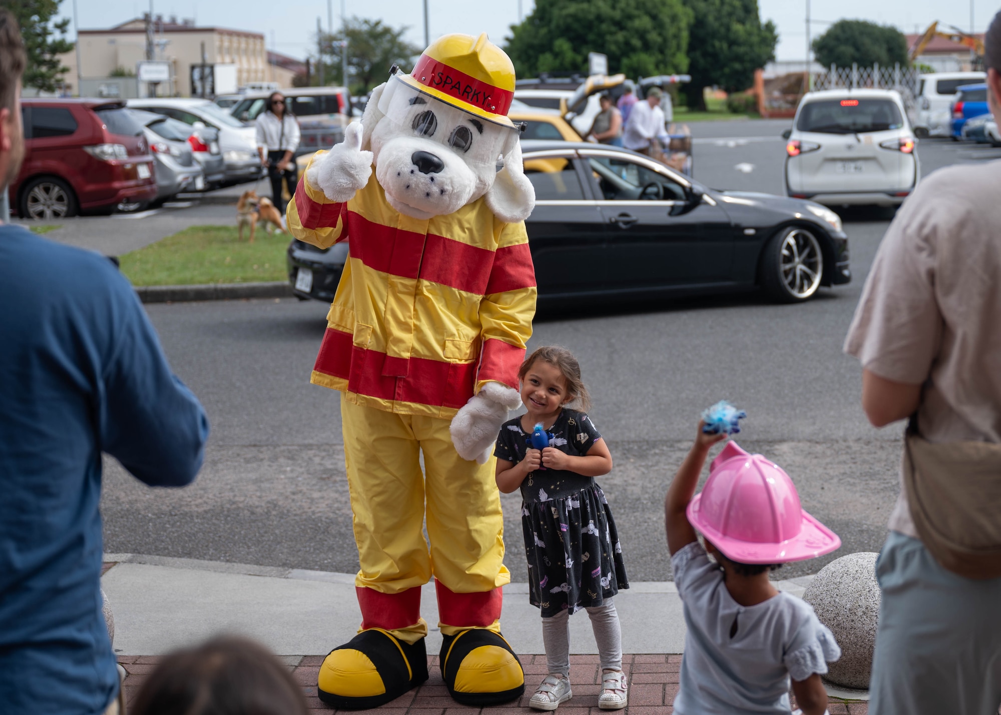 Sparky the Dog poses with a child.