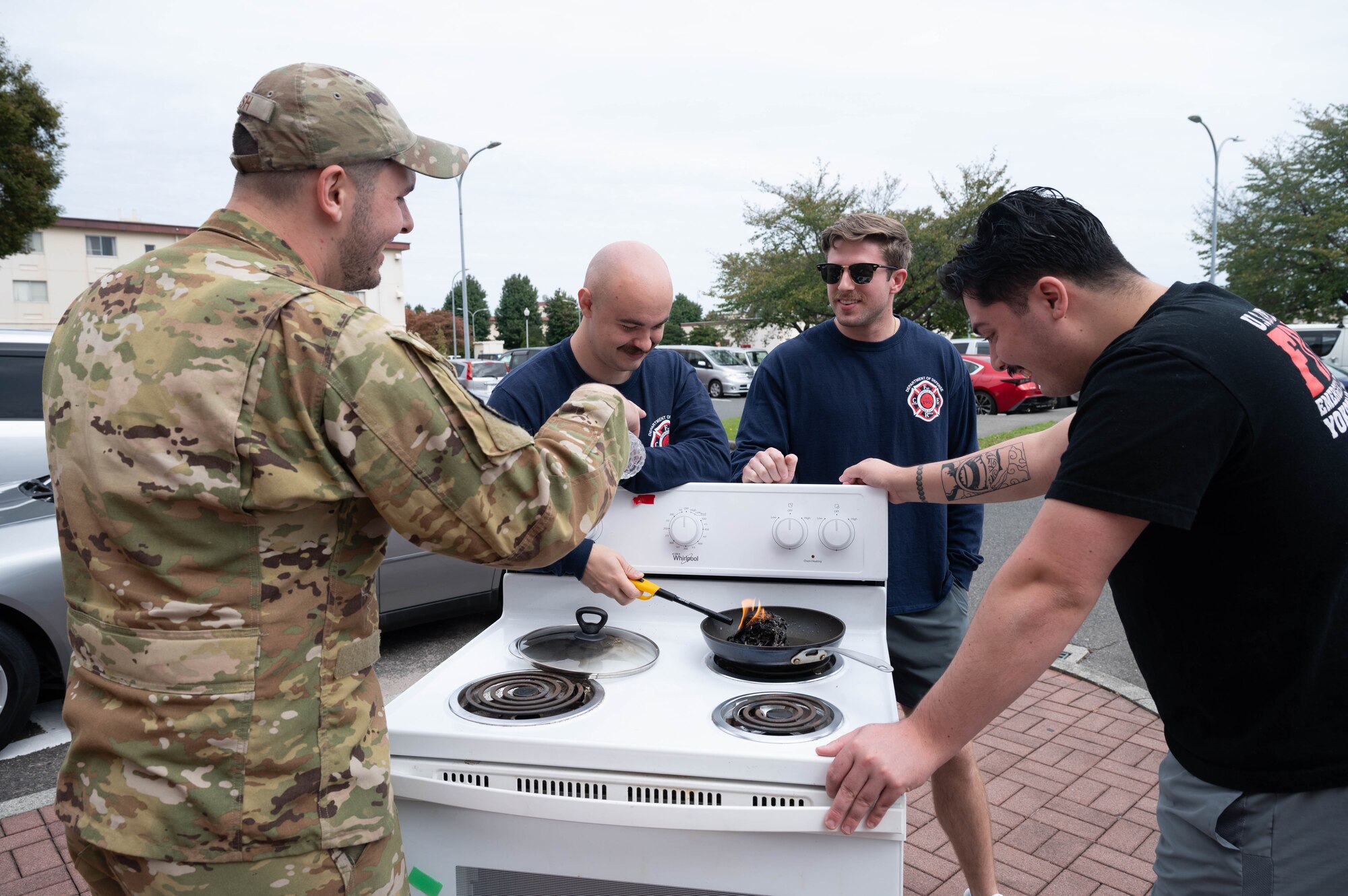 Firefighters simulate a kitchen fire.