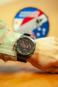 A servicemember's wrist models a smartwatch.