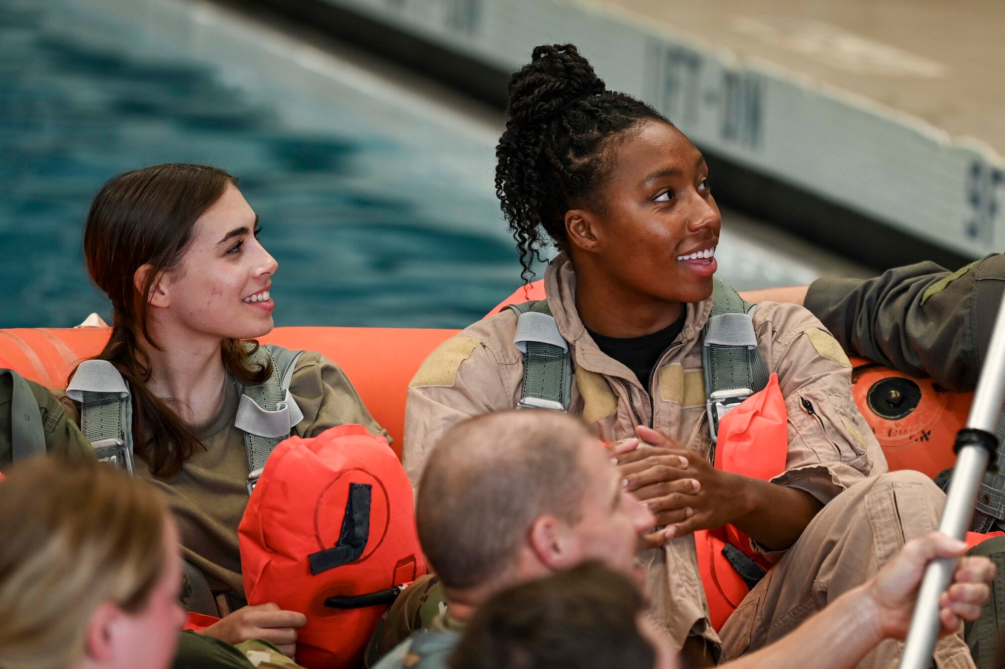 Team USA swimmer sits in raft