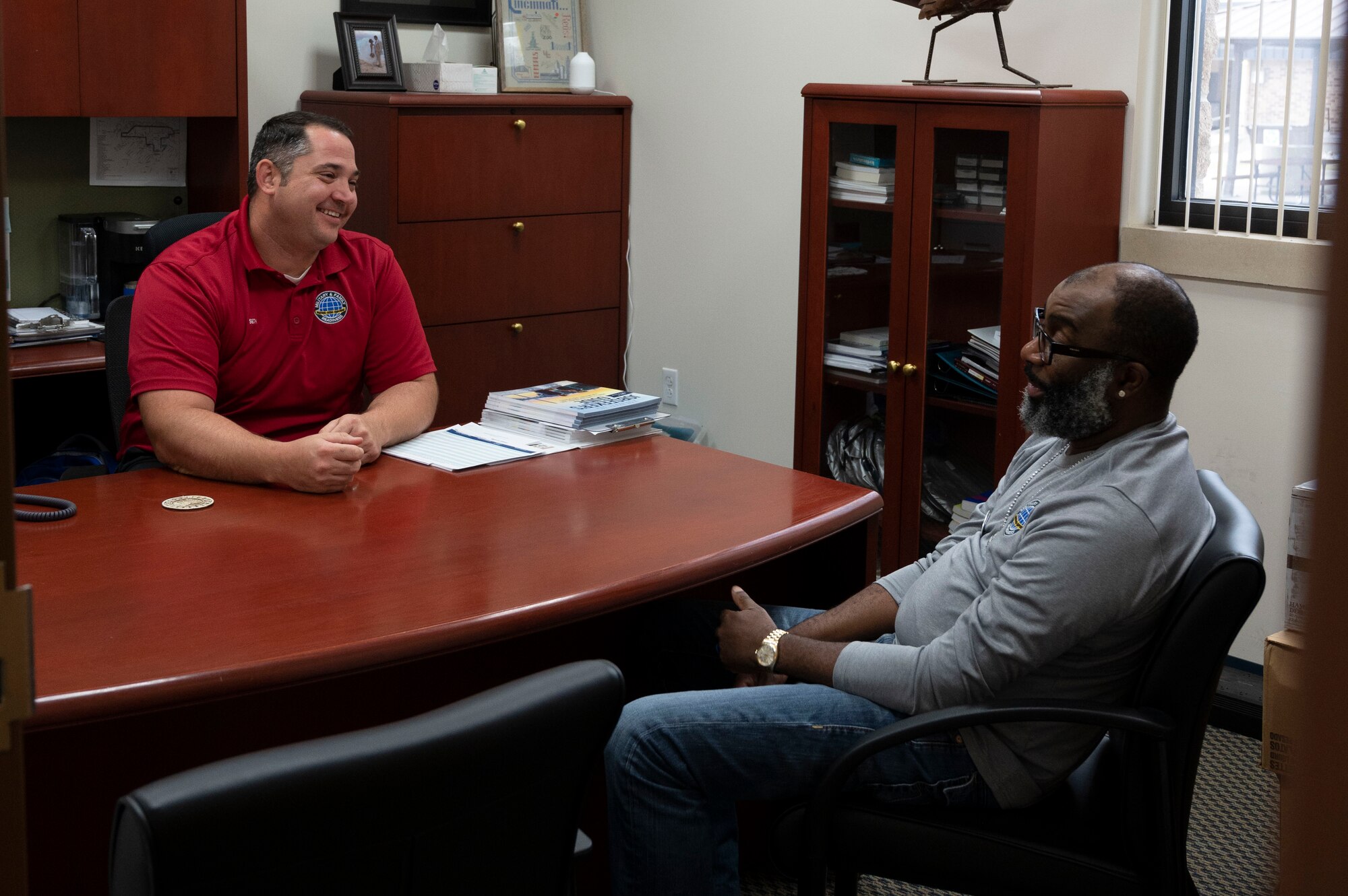 Seth Martini and Anthony Williams, 47th Force Support Squadron financial advisors, sit in their office at the Military and Family Readiness Center at Laughlin Air Force Base, Texas, Oct. 13, 2023. Williams and Martini provide Airmen with information, education, and personal financial counseling to assist them in achieving financial stability. (U.S. Air Force photo by Airman 1st Class Kailee Reynolds)