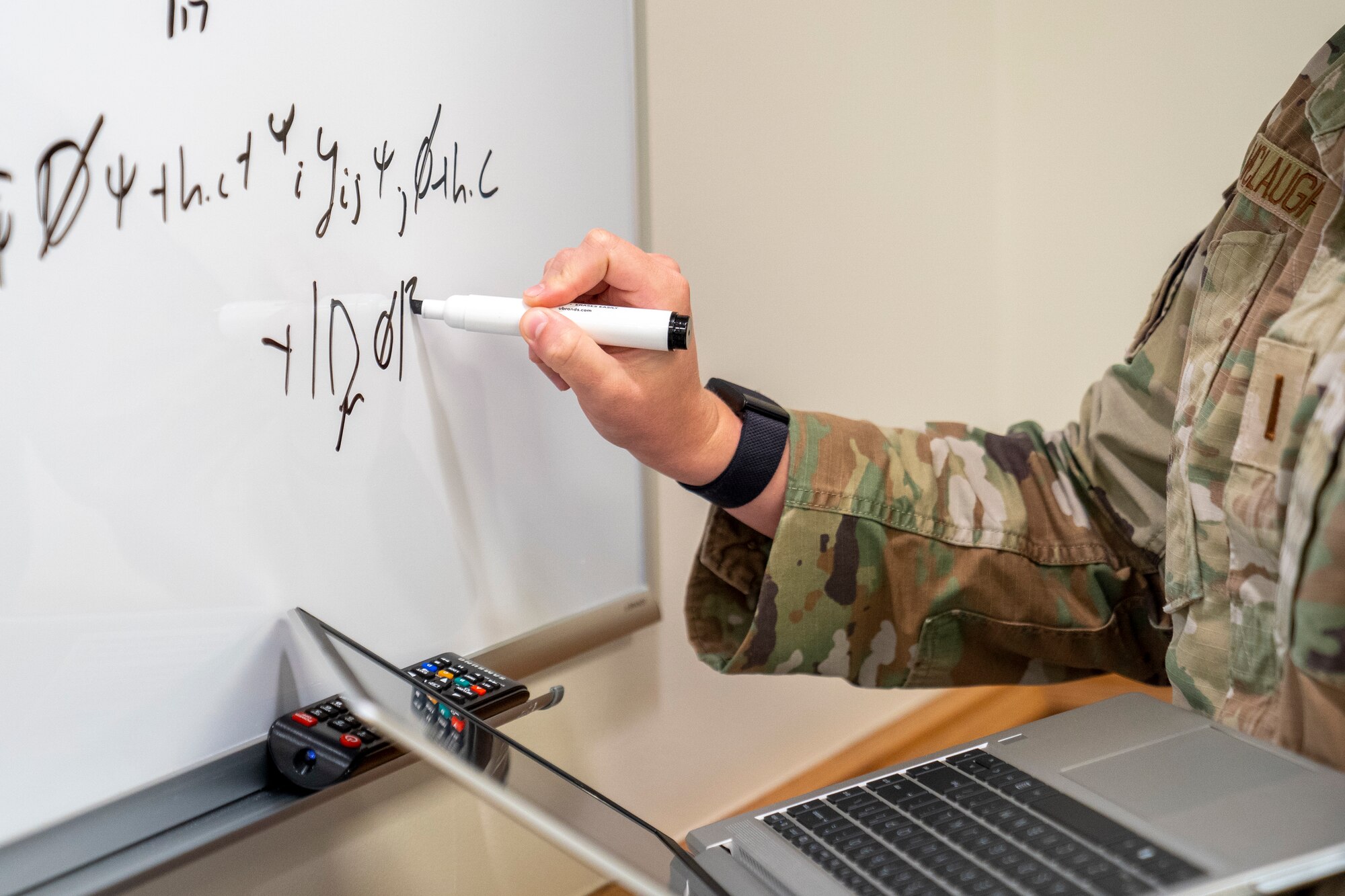 U.S. Air Force 2nd Lt. Emelia McLaughlin, 335th Training Squadron operation analysis student, shows her work in problem-solving at Allee Hall on Keesler Air Force Base, Mississippi, Oct. 10, 2023.