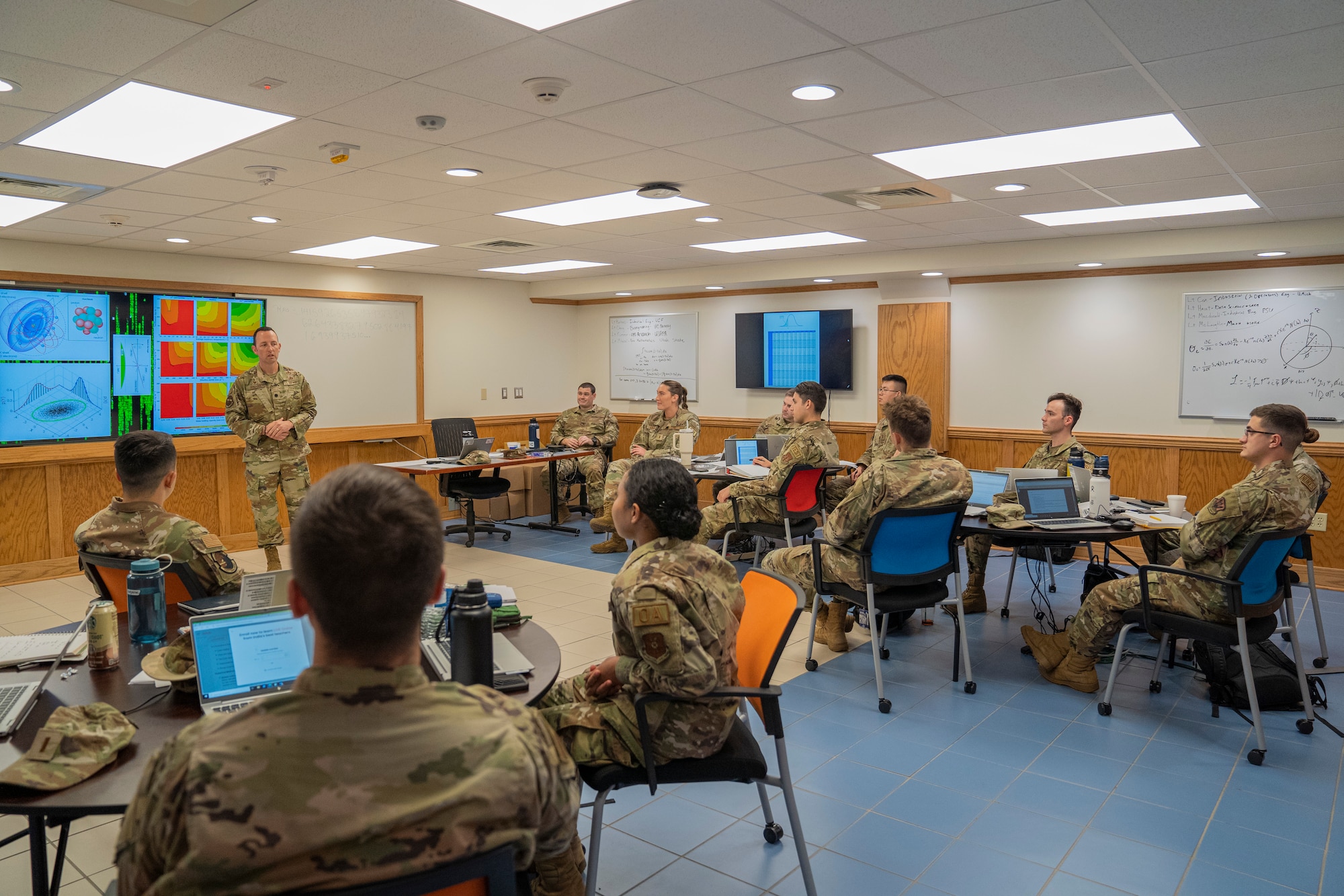 Operation analysis students from the 335th Training Squadron listen to U.S. Air Force Lt. Col. Christopher Donahue, 335th TRS commander, explain what they'll be doing in initial skills training at Allee Hall on Keesler Air Force Base, Mississippi, Oct. 10, 2023.