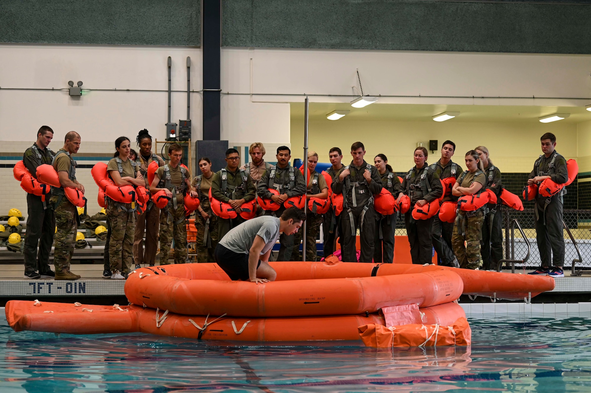Group of SERE students wait to enter raft
