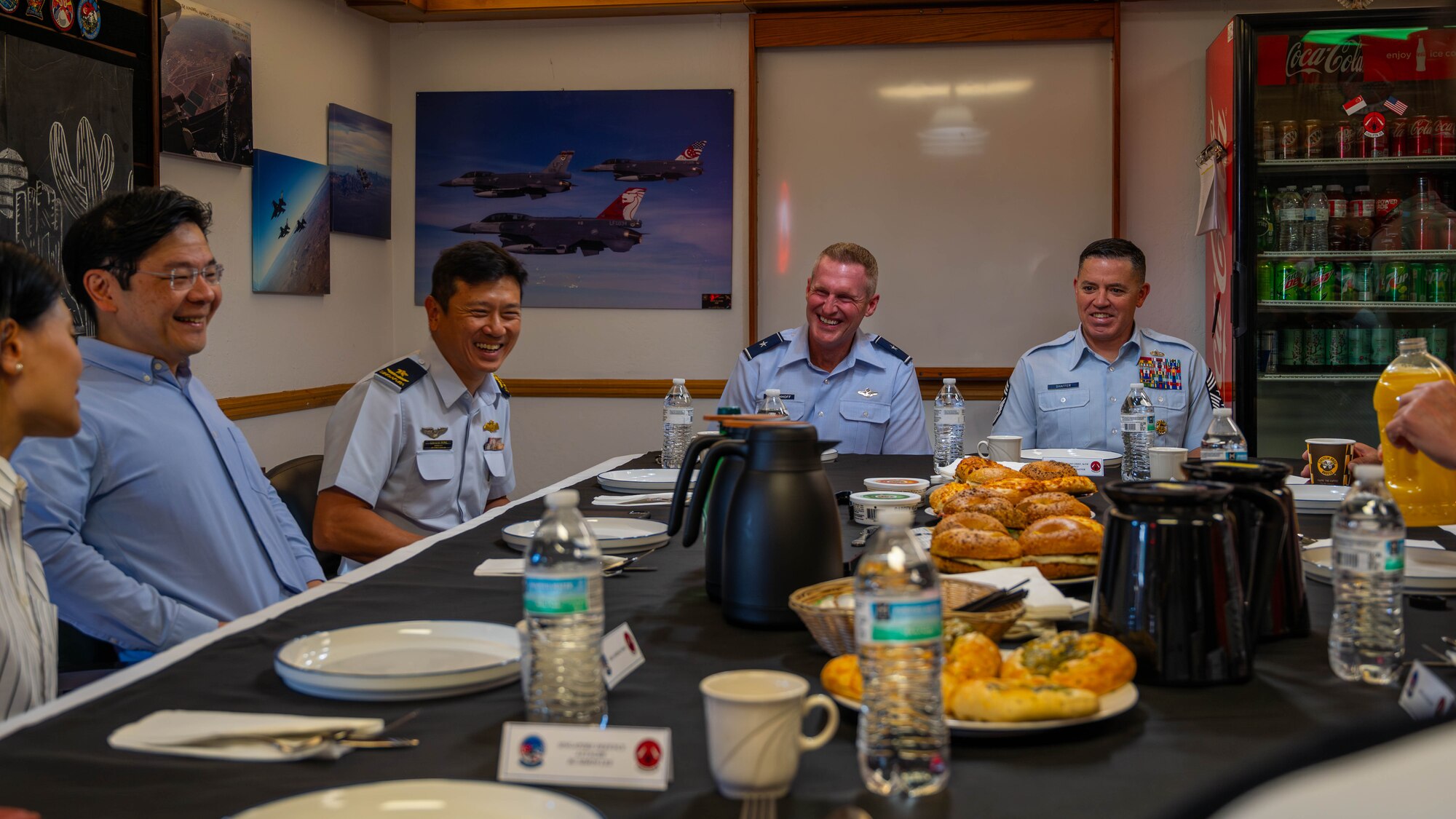 U.S. Air Force Brig. Gen. Jason Rueschhoff (center), 56th Fighter Wing commander, and Chief Master Sgt. Jason Schaffer, 56th FW command chief, attend a breakfast Oct. 6, 2023, at Luke Air Force Base, Arizona.