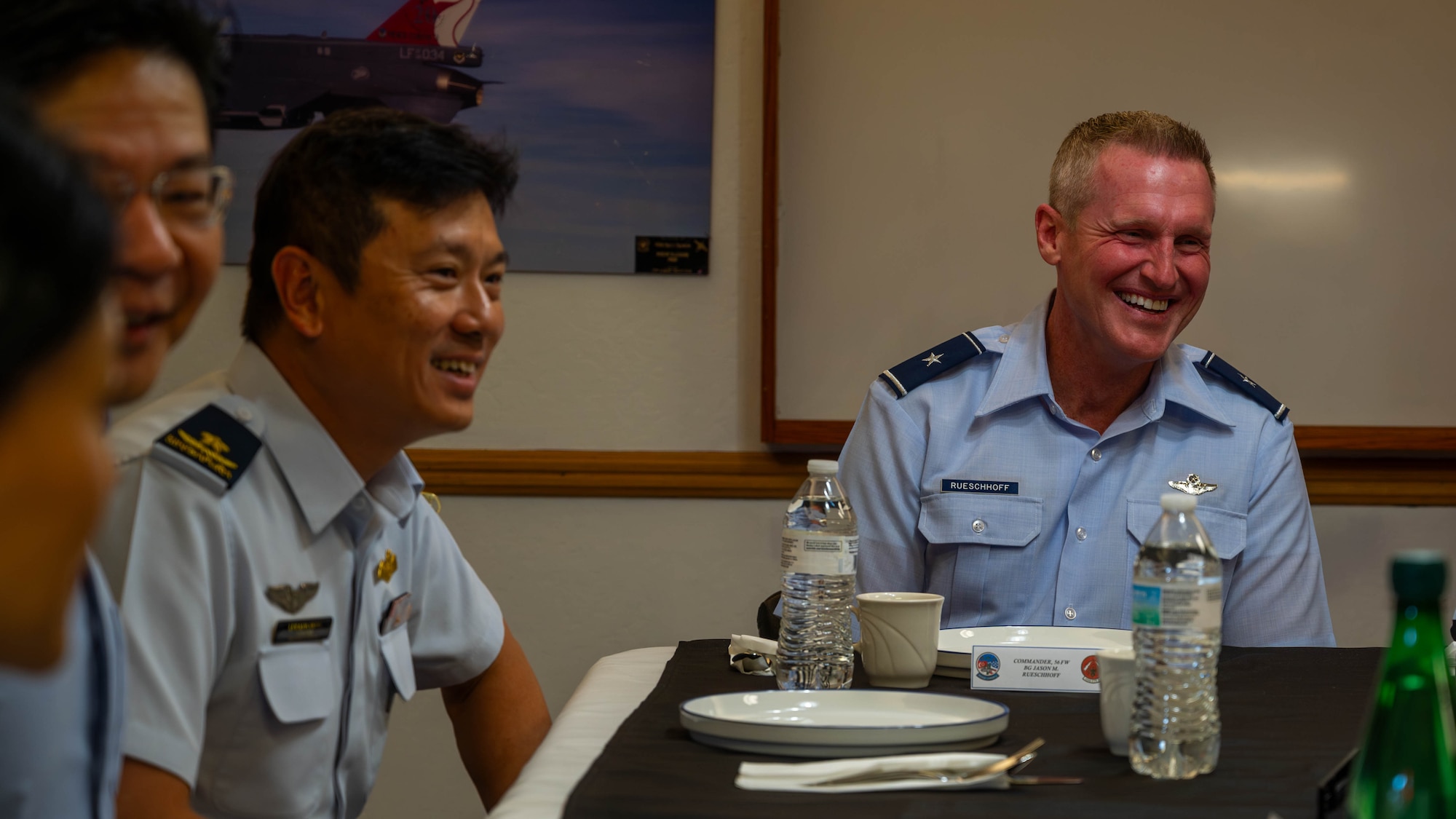 U.S. Air Force Brig. Gen. Jason Rueschhoff (right), 56th Fighter Wing commander, and Republic of Singapore Air Force Brig. Gen. Lim Kok Hong (left), RSAF Air Combat Command commander, attend a breakfast Oct. 6, 2023, at Luke Air Force Base, Arizona.
